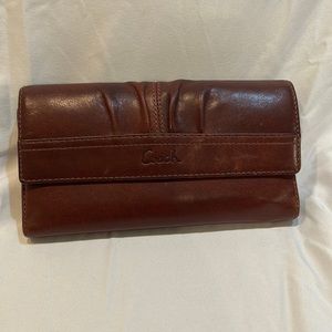 Brown coach, leather wallet
